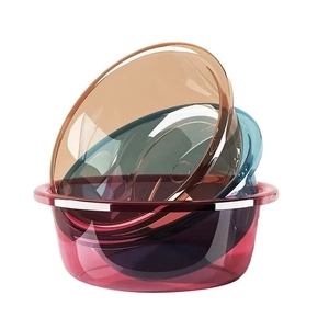 Set of four colorful transparent thickened plastic washbasins in stackable round design