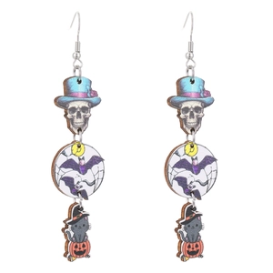 Detail of wooden Halloween earrings featuring skeleton, bat, and black cat on pumpkin
