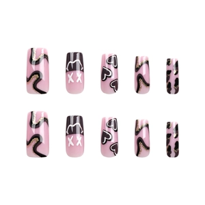 Pink and black press-on nails with heart, leopard patterns and street style wavy lines