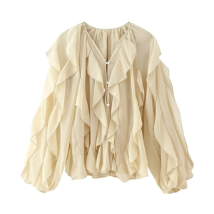 Elegante beige blouse met ruches en lange mouwen met gelaagd design en knopen