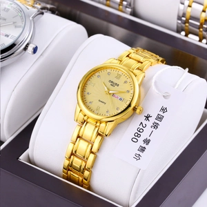 Detail of ORUSS gold quartz watch with sunray dial and day-date display in a black gift box