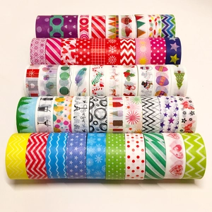 Collection of colorful decorative washi tapes with festive holiday patterns on white background