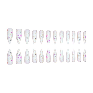 Macro detail of almond false nails with colorful glitter sequins on pearl white base