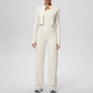 Detailed view of cream white three-piece yoga set with zip jacket, vest and wide-leg pants