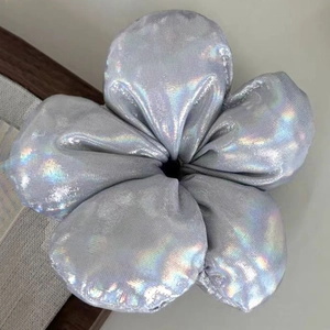 Detailed macro view of large silver flower hair scrunchie with holographic fabric texture