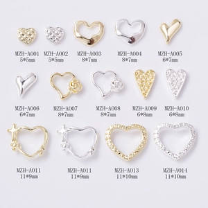 Assorted gold and silver metal alloy heart charms for luxury nail art and DIY decor