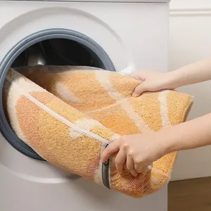 Absorbent fruit pattern bathroom mat in a mesh laundry bag for machine wash protection
