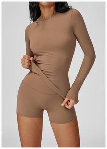 Mocha brown two-piece yoga set with long sleeve top and high-waisted fitness shorts