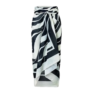 Detailed view of black and white zebra pattern sarong wrap skirt with side knot detail