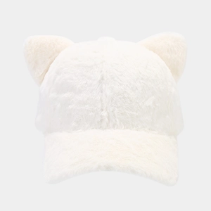Detail of white plush baseball cap featuring cute fluffy cat ears and soft texture