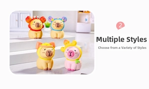 Macro detail of assorted resin capybara figurines with colorful fruit and animal hats