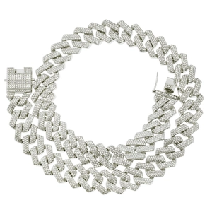 Detail shot of silver Cuban link necklace featuring three rows of sparkling rhinestones