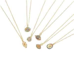 Golden evil eye pendant necklaces with colorful zircon stones on white background
