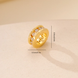 Macro view of a 9mm gold-plated spacer bead with cubic zirconia stones for DIY jewelry