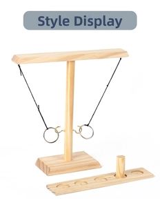 Detail of wooden hook and ring toss game set with natural pine wood texture and scoring base