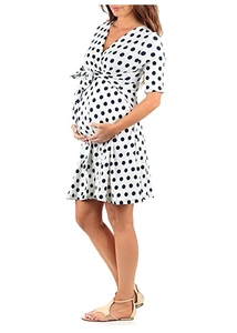 Detail of white polka dot maternity dress featuring V-neckline and adjustable waist tie
