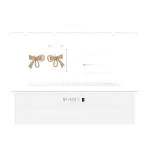 Detail view of pearl bow earrings with specifications on material, size, and weight