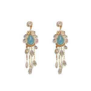 Vintage floral drop earrings with crystal tassels and blue rhinestones on white background