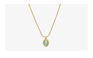 Detail of 18k gold chain featuring green cat-eye stone pendant and small bead accents