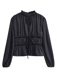 Detail of black French-style blouse with pleated collar and adjustable waist ties
