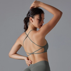 Detail view of the criss-cross back straps on an olive green high-elastic sports yoga bra