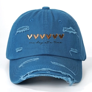 Distressed blue cotton baseball cap with gradient hearts and one day at a time text