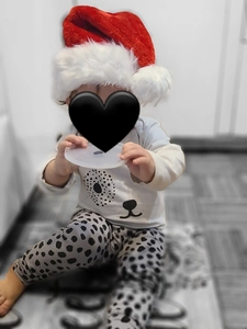 Plush red Christmas hat with soft white pompom for festive holiday decorations and kids