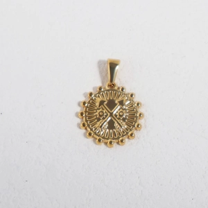 Detailed view of a 24K gold plated stainless steel pendant with double axe and star relief