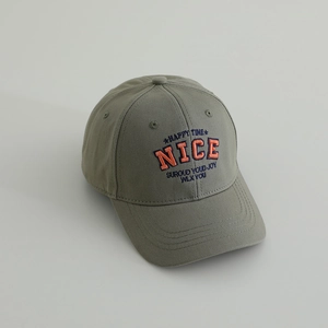 Close-up of military green cotton baseball cap with orange NICE letter embroidery