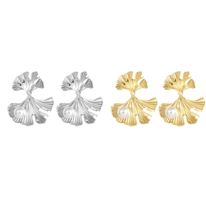 French vintage ginkgo leaf pearl earrings in gold and silver finish on white background