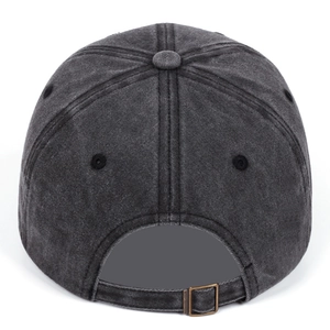 Detail of vintage washed cotton baseball cap with adjustable bronze metal buckle