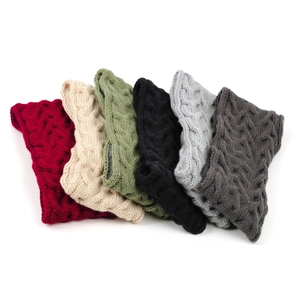 Detailed knit texture of vintage cable knit leg warmers in various autumn colors
