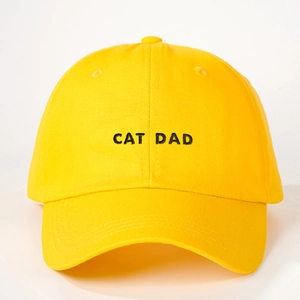 Detail of the high-quality black Cat Dad embroidery on this yellow cotton baseball cap