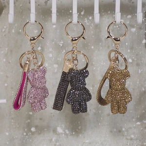 Sparkling rhinestone violent bear keychain set in pink, grey and gold finishes