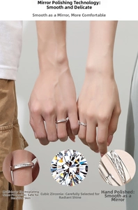 Detail of silver couple rings showing cubic zirconia inlay and leaf-like texture