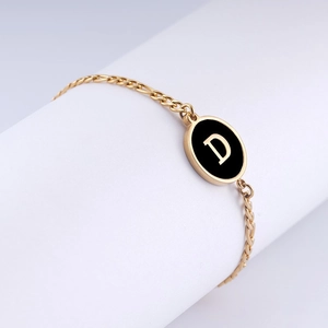 18K gold plated stainless steel chain bracelet with black oval pendant featuring letter D