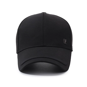 Classic black cotton baseball cap with a small metal logo detail and curved brim