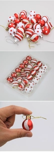 Detail view of 3cm red and white Christmas balls with polka dots and stripe patterns