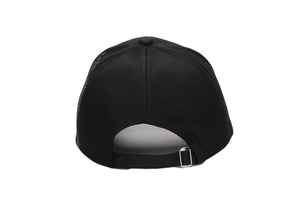 Detail of adjustable silver metal buckle and strap on back of black cotton baseball cap