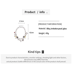Detail chart of pearl cross and star pendant necklace showing size 42cm and materials