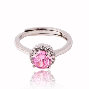 Macro detail of silver adjustable ring with pink round zircon and white crystal halo