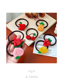 Detail of high-elasticity hair ties featuring assorted acrylic fruit charms with rhinestones