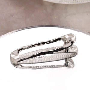 Modern silver irregular hollow metal hair clip with a geometric polished finish design