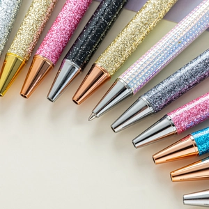 Set of glitter metal retractable ballpoint pens in various shimmering colors and finishes