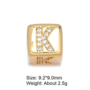 Macro shot of 18k gold plated letter K bead with micro-pave cubic zirconia stones