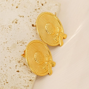 Detail of gold sun hat stud earrings with bow tie and woven texture on stone and silk