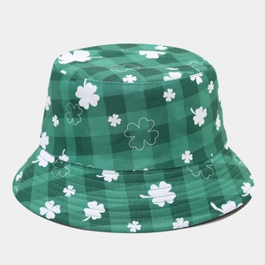 Detail shot of the green plaid fabric and clover embroidery on the foldable bucket hat