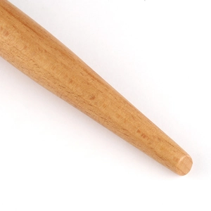 Macro shot of the smooth natural wood handle with fine texture and warm grain finish
