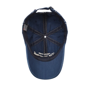 Inside view of vintage washed navy blue cotton baseball cap with adjustable metal buckle