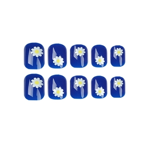 Blue daisy press-on nails set with glossy floral pattern on a minimalist white background